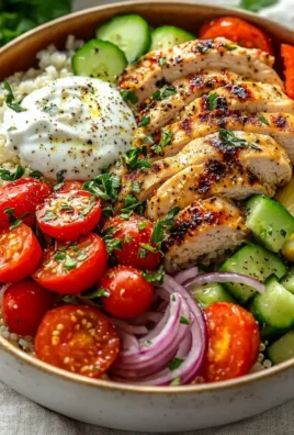 Delicious Greek Chicken Bowl with marinated chicken and fresh vegetables