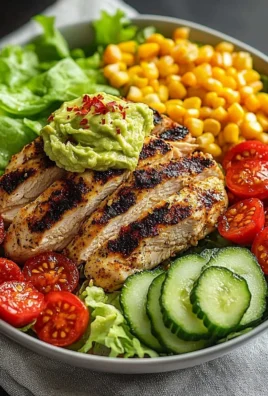 Grilled chicken avocado salad in a bowl, a healthy meal prep option