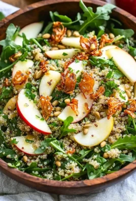 Honey Mustard Quinoa Apple Salad with Crispy Shallots garnished and served in a bowl