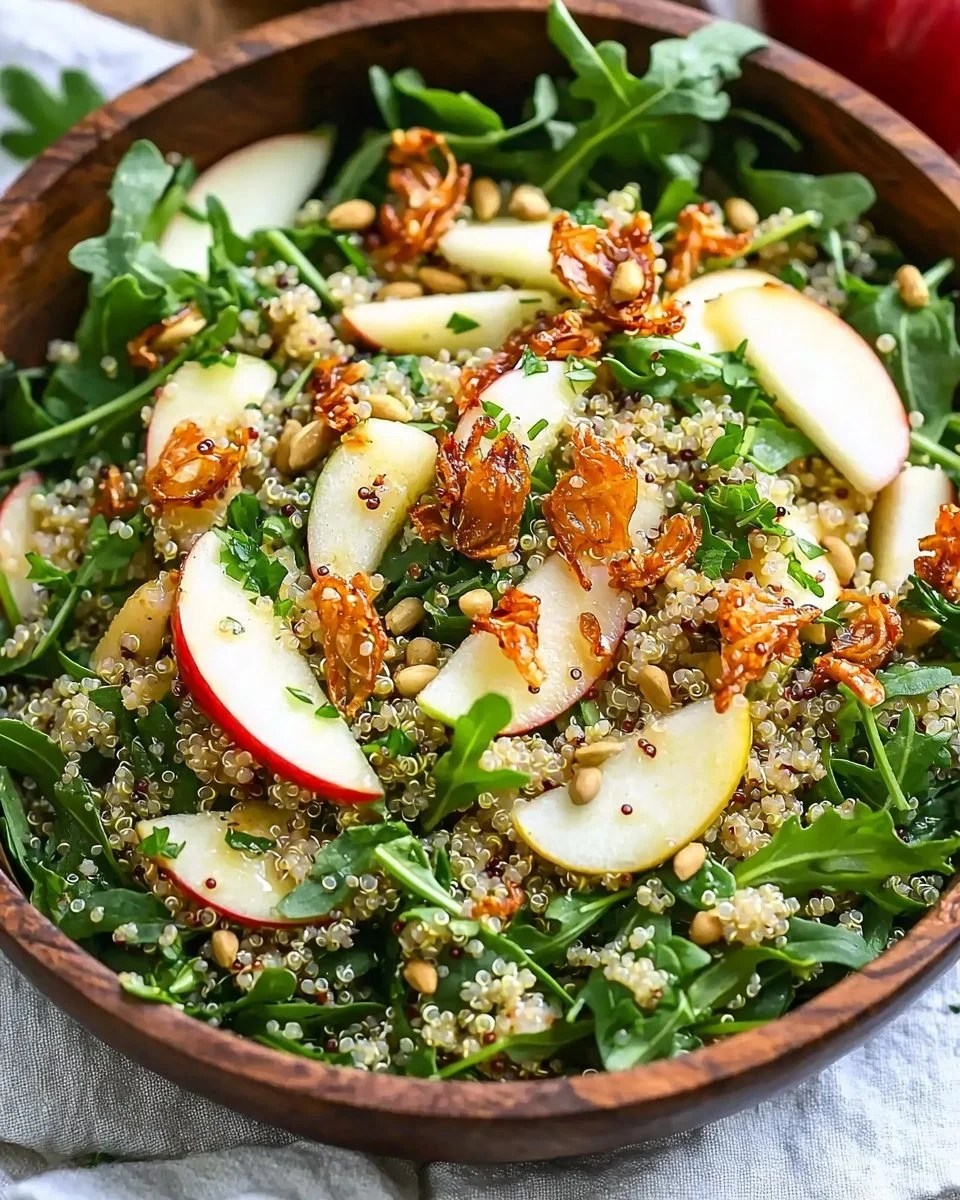 Honey Mustard Quinoa Apple Salad with Crispy Shallots garnished and served in a bowl