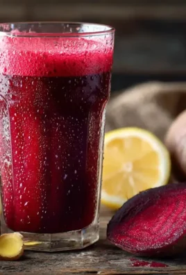 Beetroot and ginger cleanse juice in a glass with vibrant colors