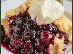 Freshly baked Blackberry Cobbler with juicy blackberries and flaky crust.