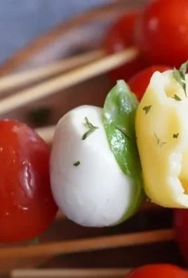 Delicious Caprese Tortellini skewers with cherry tomatoes and basil