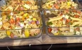 Colorful Chicken Pasta Salad with vegetables and dressing served in a bowl