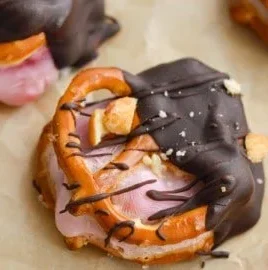 Chocolate dipped strawberry yogurt pretzel bites garnished with sprinkles
