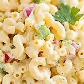 Bowl of classic macaroni salad with vegetables, perfect summer side dish