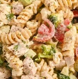 Creamy high-protein pasta salad with chicken, vegetables, and dressing
