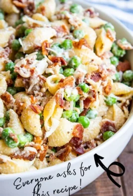 Delicious creamy pasta salad with vegetables and dressing served in a bowl