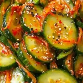 A bowl of Crispy Cucumber Kimchi garnished with scallions and sesame seeds