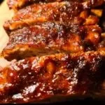 Crock Pot baby back ribs cooked to perfection with BBQ sauce and spices