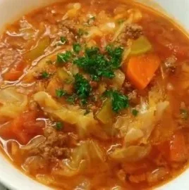 Bowl of Easy Cabbage Roll Soup garnished with fresh herbs