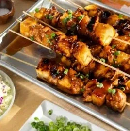 Grilled Hawaiian chicken kabobs with pineapple and bell peppers on skewers