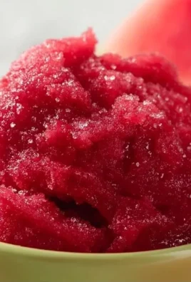 Bowl of easy watermelon raspberry sorbet topped with fresh raspberries