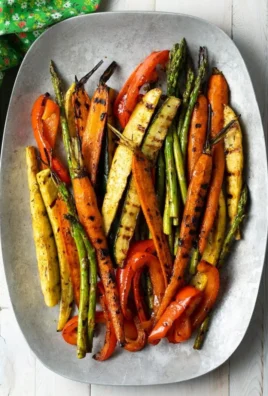 Colorful grilled vegetables marinated for added flavor on the barbecue grill.