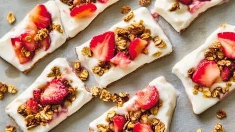 Healthy frozen yogurt bark topped with fresh fruits and nuts