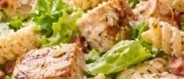 High-protein chicken caesar pasta salad served in a bowl