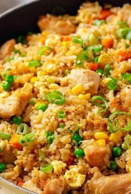 High Protein Chicken Fried Rice served in a bowl with colorful vegetables and chicken