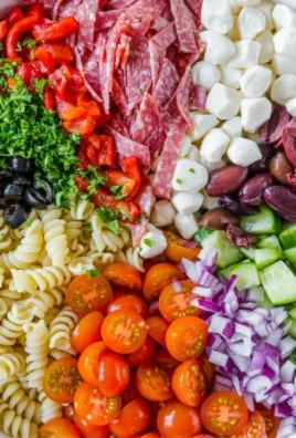 Colorful bowl of Italian Pasta Salad with vegetables and dressing