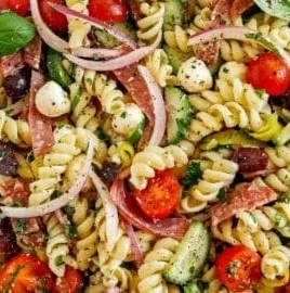 Colorful Italian pasta salad with fresh vegetables and dressing
