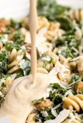 Kale Caesar Pasta Salad with creamy dressing and crunchy toppings
