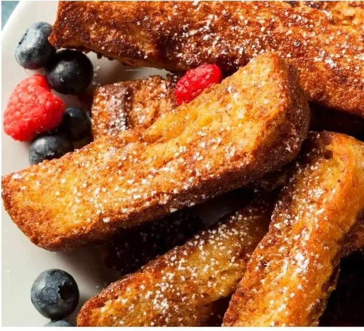 Delicious low calorie high protein French toast sticks served with syrup.
