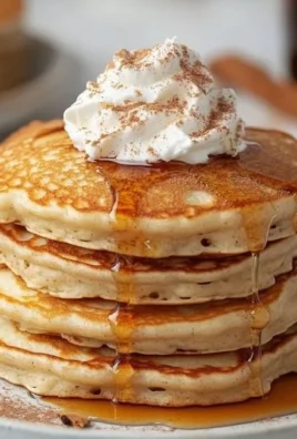 Delicious low-calorie protein pancakes topped with cinnamon and Greek yogurt