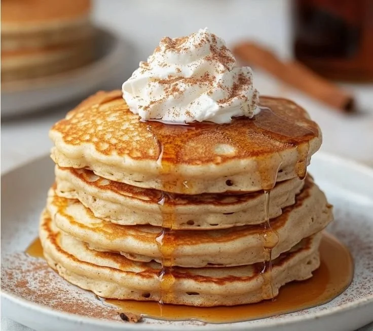 Delicious low-calorie protein pancakes topped with cinnamon and Greek yogurt