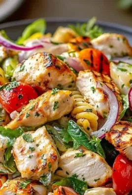 Mediterranean Chicken Pasta Salad with fresh vegetables and dressing