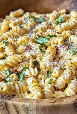 Bowl of Mexican street corn pasta salad with fresh ingredients and vibrant colors