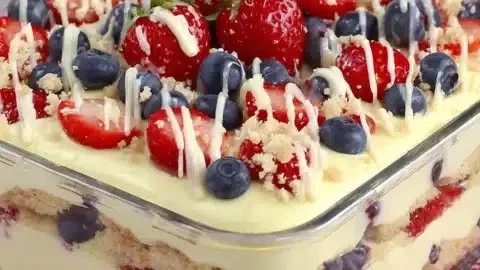 No Bake Summer Berry Icebox Cake topped with fresh berries and whipped cream