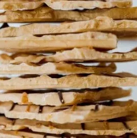 Peanut Butter Chocolate Greek Yogurt Bark topped with nuts and chocolate chips