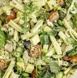 Colorful and nutritious Protein Pasta Salad with fresh vegetables and dressing