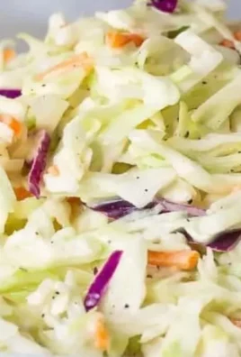 Southern coleslaw served in a bowl with fresh ingredients