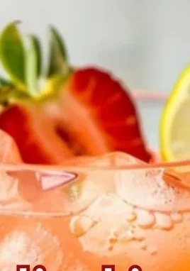 Strawberry Dream cocktail in a glass with fresh strawberries and mint garnish
