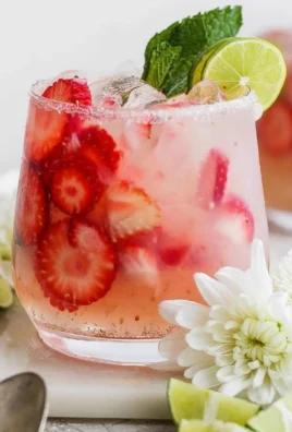 Delicious strawberry mojito in a glass with mint and strawberries