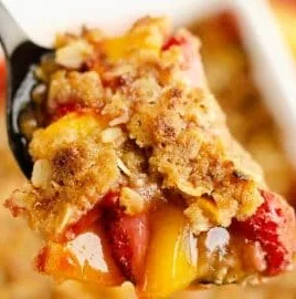 Delicious Strawberry Peach Crisp topped with golden oat crunch