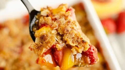 Delicious Strawberry Peach Crisp topped with golden oat crunch