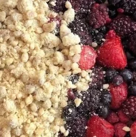 Delicious frozen berry cobbler served in a dish, topped with a golden crisp