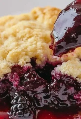 Delicious homemade blackberry cobbler with a golden crust and fresh berries