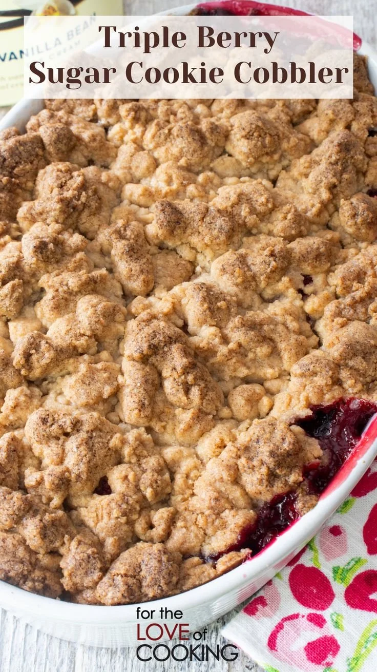 Triple Berry Sugar Cookie Cobbler dessert topped with fresh berries
