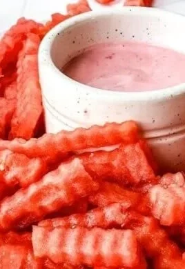 Plate of crispy watermelon fries served with strawberry yogurt dip