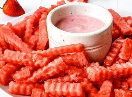 Plate of crispy watermelon fries served with strawberry yogurt dip
