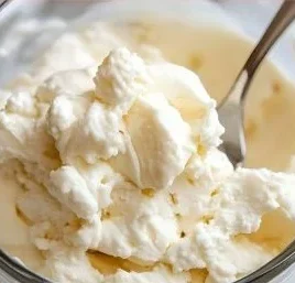 Creamy 2 ingredient cottage cheese ice cream served in a bowl with toppings.
