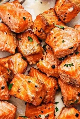 Air fryer salmon bites with lemon garlic butter sauce served on a plate