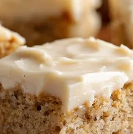 Delicious banana bread brownies topped with chocolate and walnuts