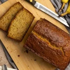 Delicious banana bread with Greek yogurt, fresh bananas, and a golden crust