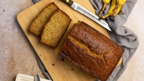 Delicious banana bread with Greek yogurt, fresh bananas, and a golden crust