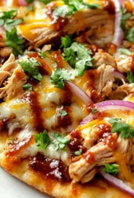 BBQ chicken flatbread topped with fresh ingredients and garnished beautifully