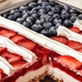 Delicious Strawberry Pretzel Jello Salad layered with strawberries, pretzels, and creamy topping