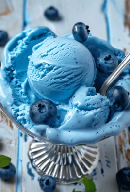 A bowl of homemade Blue Moon Ice Cream with a vibrant blue color.